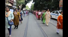 Nursing staff are take part in a protest march against the rape and murder of a PGT woman doctor at Government-run R G Kar Medical College & Hospital, in Kolkata, India