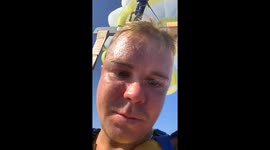 Excitement quickly fades as first-time parasailer struggles with stomach-churning ocean view