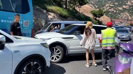 Furious woman repeatedly slaps motorist in front of his kids after collision at tourist hotspot in China