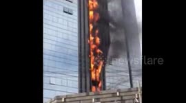 Under construction skyscraper on fire in China