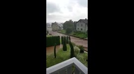 Floodwater flows through German town after storm