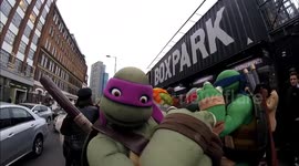 The Teenage Mutant Ninja Turtles meet a drunk man outside of the Boxpark in Shoreditch  