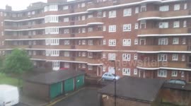 Intense rainstorm interrupts sunshine in London, UK