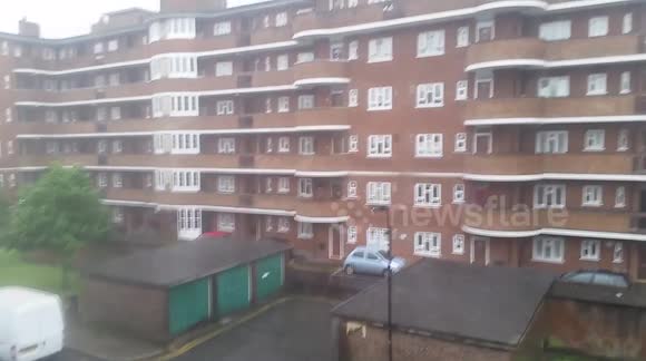 Intense rainstorm interrupts sunshine in London, UK