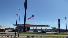 Flag Fluttering Against Blue Sky
