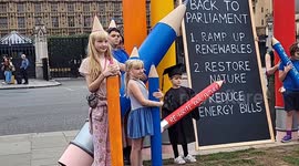 Mother's Rise Up campaign outside Parliament for     a fast-and-fair switch to renewable energy