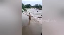 Police teams heroically rescue a man from drowning in Flood waters in Medak Telengana, South India