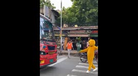 Teddy bear costume controls traffic in Bangladesh after government overthrown