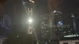 Colleagues arrange office lights at night to spell 'HBD' for friend