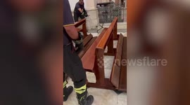Give fangs to the Lord! Firemen chase snake around church in Italy