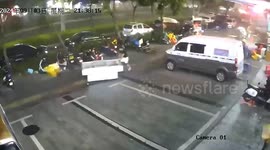 Staff rushes to catch freezers swept away during typhoon 