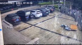 Billboard ripped off building by typhoon winds strikes passing motorcyclist in southern China