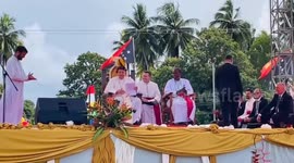 Pope Francis visits remote communities in Papua New Guinea, wearing a hat decorated with bird of paradise feathers