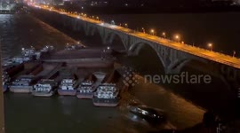 Strong winds blow fleet of cargo ships into bridge in China