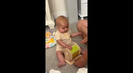 Child pinches fingers on rotating wheel after burping