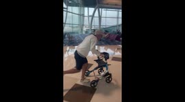 Passenger topples over while fooling around with airport stroller