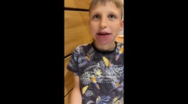 Son's blue lips amuse parent in Katowice, Poland