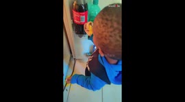 Mom finds her son munching on a raw egg in the kitchen 