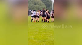 Teen rugby player celebrates try with t shirt which reads: 