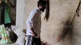 India: Snake catcher rescued a cobra sitting behind a sack inside the house in Haryana