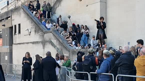 Anna Wintour is forced to abandon her car and made to go through the public to get to the Burberry show due to protestors from Petra holding up her car