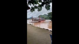 Ferry sweeps away by fast-flowing river