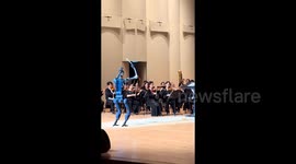 Watch this robot conductor complete a great music show in Beijing, China