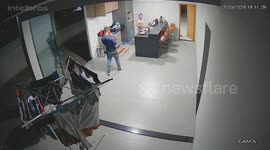 Husband and wife fall after lift in CCTV footage from Brazil