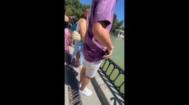 Person startles woman filming herself in Madrid