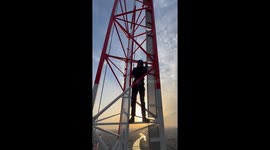 VIDEO: Man climbs WIND TURBINE to touch moving blades in shocking video (Part 3)