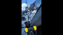 Drivers terrified by schoolboys fighting in the street