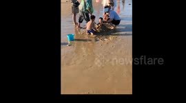 China: A Baby Gets Buried in the Sand
