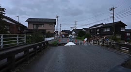 Road Collapse Near Sanno Bridge in Suzu City Leaves Car Stranded Amid Heavy Rain