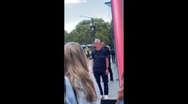 Tim Cook greets customer waiting in line at Apple Fifth Avenue, New York, USA
