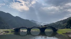China: Picture of A Old Man Herding His Cattle
