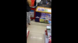 Cat in store fixated on shelf until patted