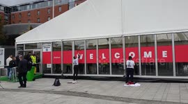 UK: Supporters of Youth Demand paint the words 'Genocide Conference' on the Labour conference