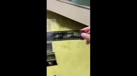 Collector restores old film reels with delicate craftsmanship