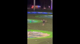 Impromptu game of cat and mouse breaks out after runner starts dodging security on golf course