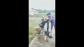 TikToker demonstrates outdoor loc wash routine for husband’s extra long hair