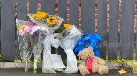 Floral tributes laid by house where mum and girl, 8, found dead