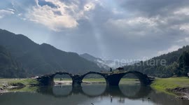 Picture of A Old Man Herding His Cattle