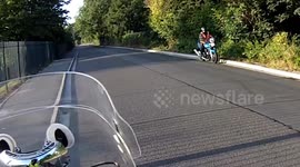 Motorcycle rider crashes on U turn.