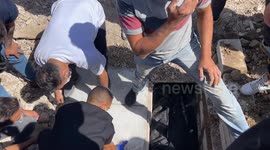 Local Imam and citizens bury the body of a deceased fellow at the funeral, Sidon, Lebanon