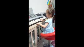 The girl enjoys playing the piano in the afternoon.