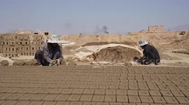 Afghan children work in brick kilns to support families