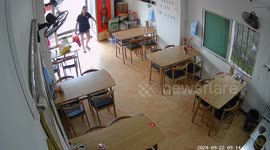 Scooter rider smashes into restaurant narrowly missing female owner