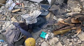 Members of the Hezbollah’s civil defence and local residents busy in restoring the building hit by the drone attack.