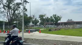 Typhoon Krathon impacts Taiwan: Severe disaster in southern Taiwan. Numerous roadside trees were uprooted by strong winds. The video shows post-disaster recovery efforts underway.