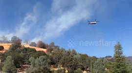 US: Aerial Assault on Glenhaven Fire: Helicopter Douses Flames as Evacuations Intensify
